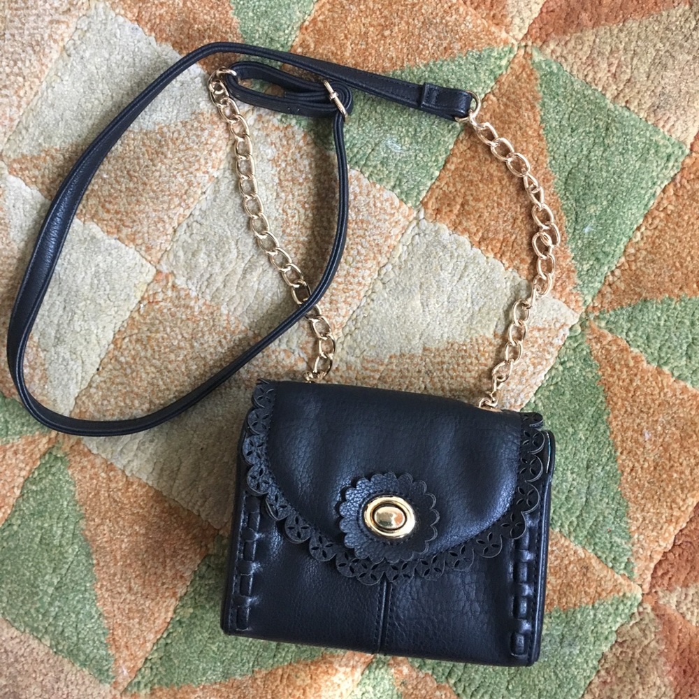 An adorable petite Big Buddha crossbody handbag